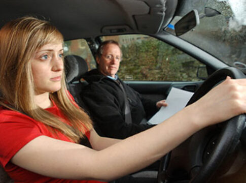 Young woman on driving test lesson