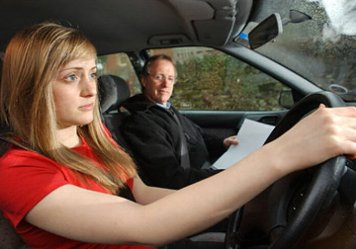 Young woman on driving test lesson