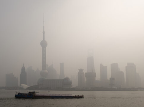 air pollution over Shanghai, a barge is passing