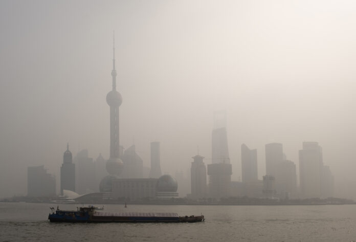 air pollution over Shanghai, a barge is passing