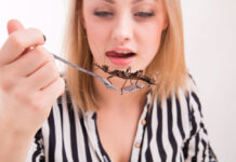 Woman eating insects