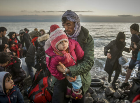 Refugees and Migrants aboard reach shore