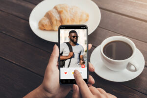 Woman using cell phone with male profile on display gonorrhoea