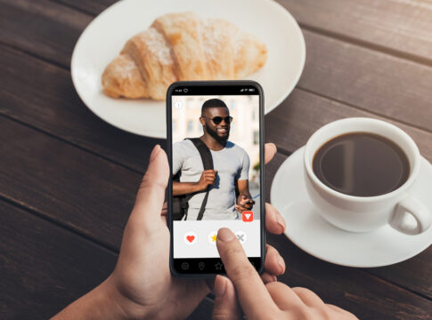 Woman using cell phone with male profile on display gonorrhoea