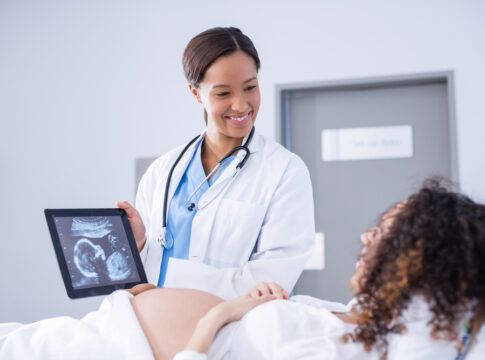 Doctor showing mother birth of trans babies